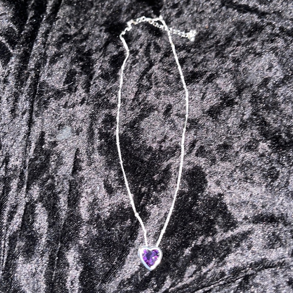 Silver tone necklace with purple stone heart pendant